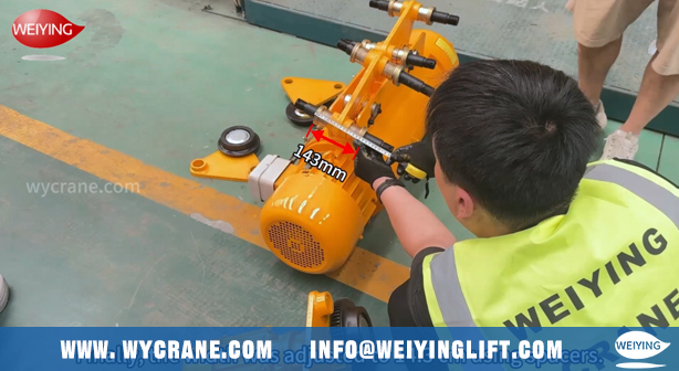 Adjusting trolley width for electric wire rope hoist installation